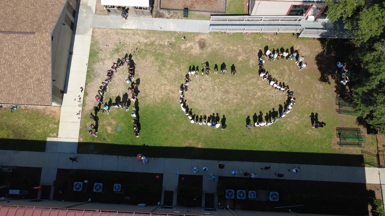 Aerial view of a school gathering on campus