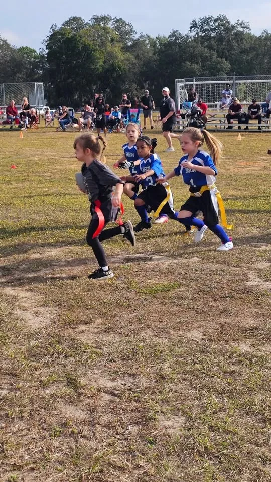Students playing flag football
