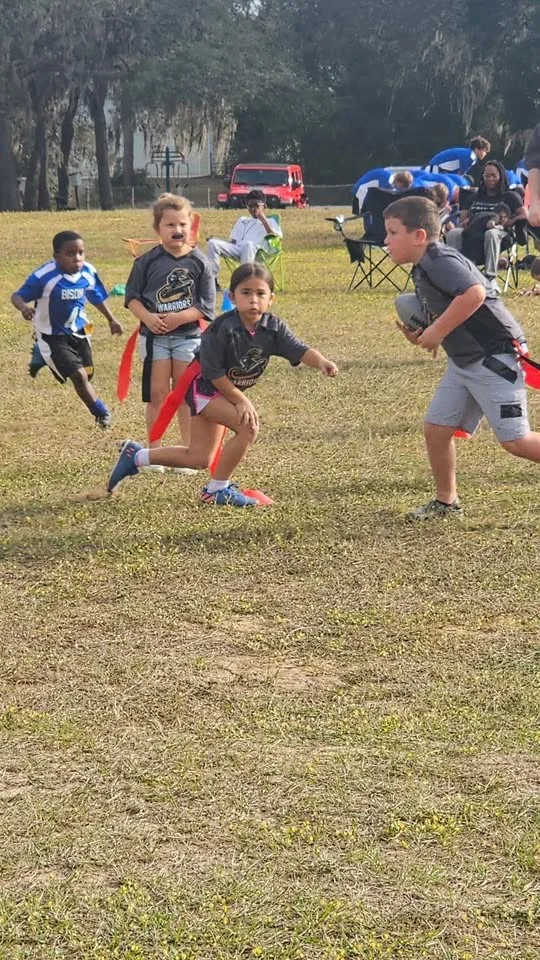 Students playing on an athletic field